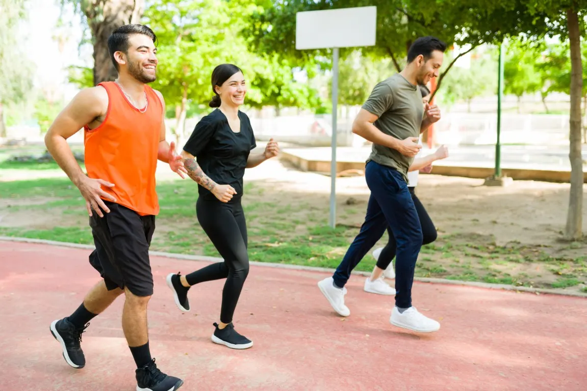 Friends jogging together in a park